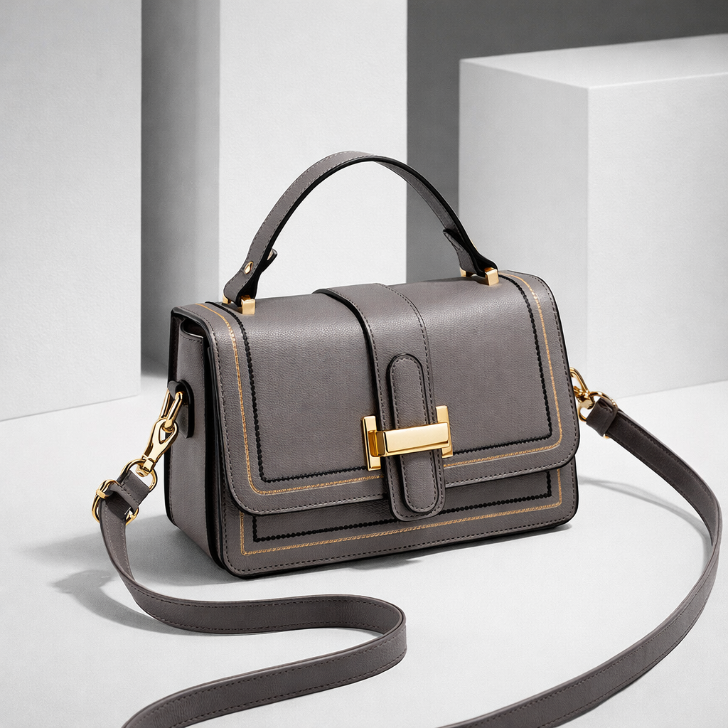 Luna Paris structured shoulder bag in grey with long strap, front angled view