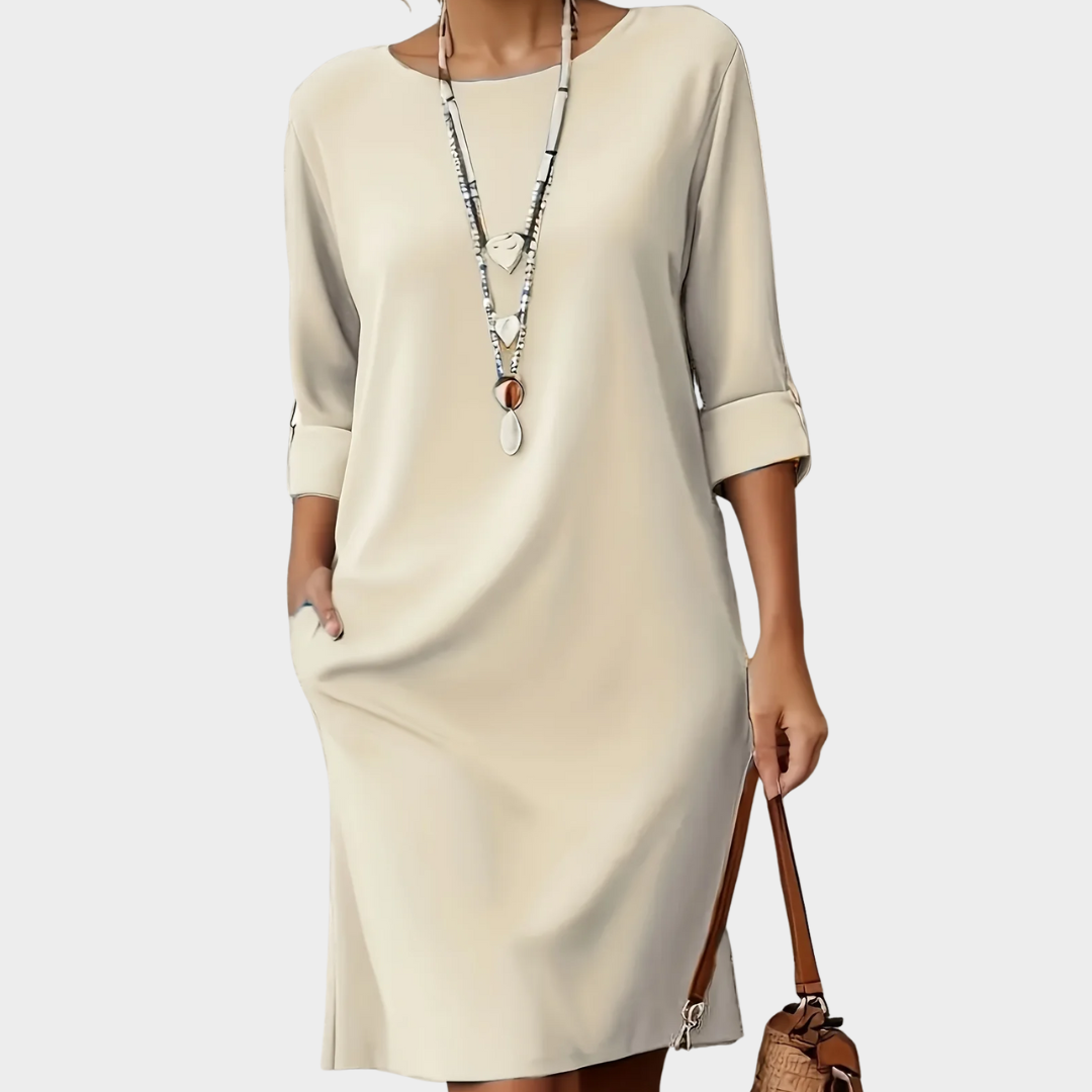 Daphne all-day dress in beige, front view with side pockets