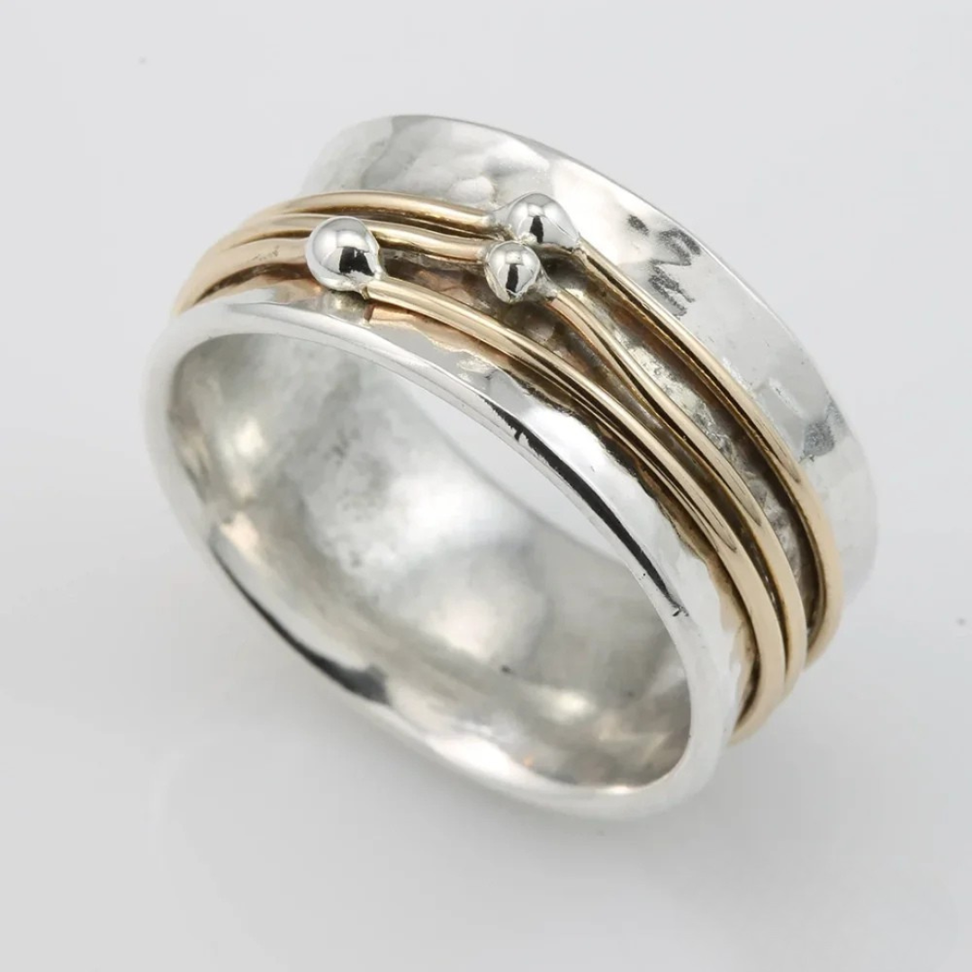 Marlene hammered silver ring with three gold bands and silver dots, side view