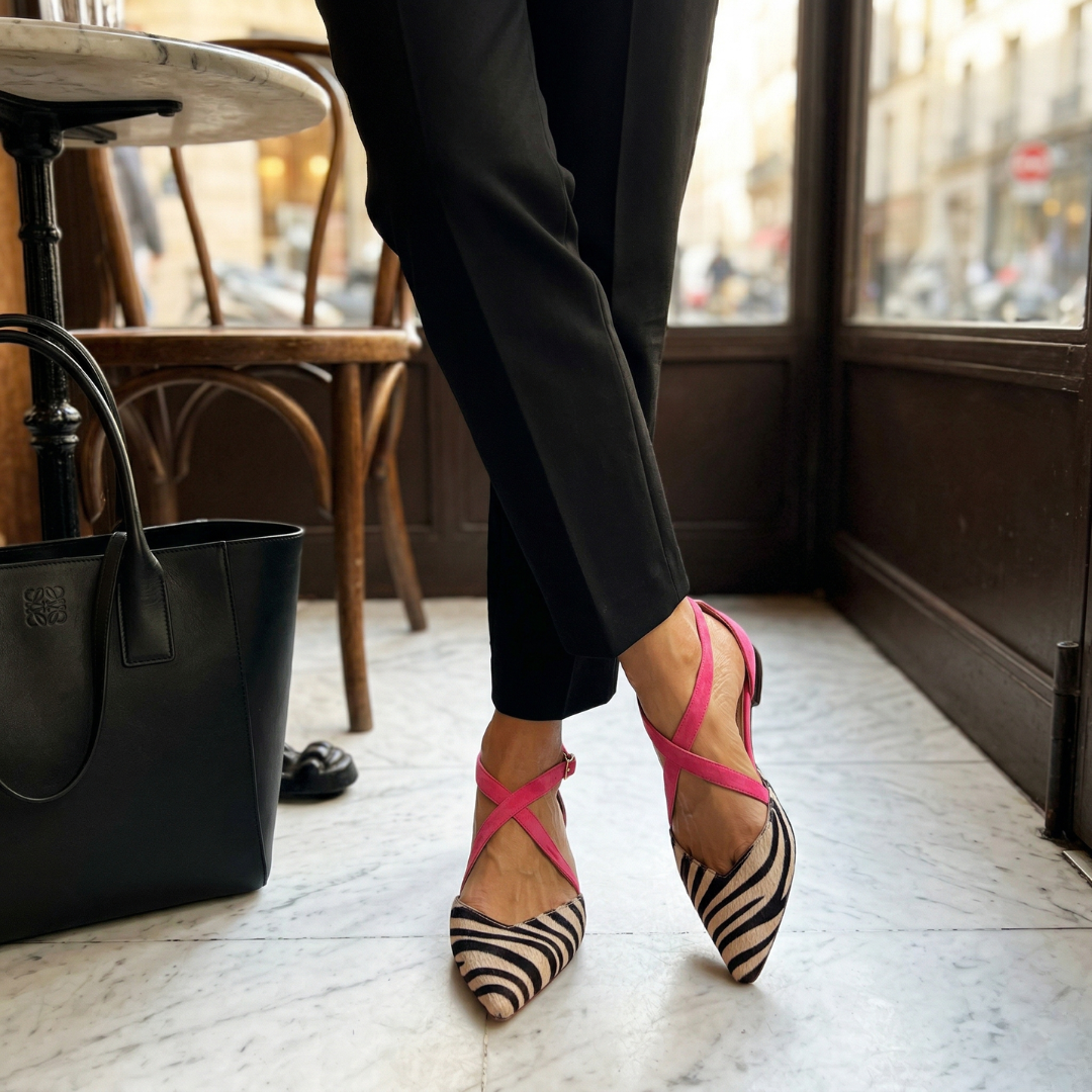 Amelia strappy ballet pumps in pink and zebra stripe worn with black trousers