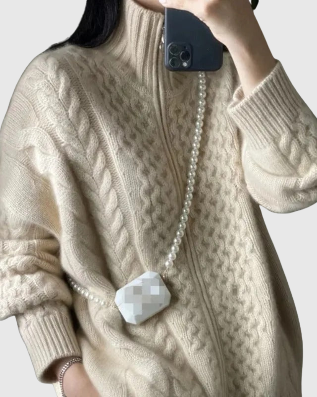 Evarine cable-knit cardigan in cream, close-up of textured knit