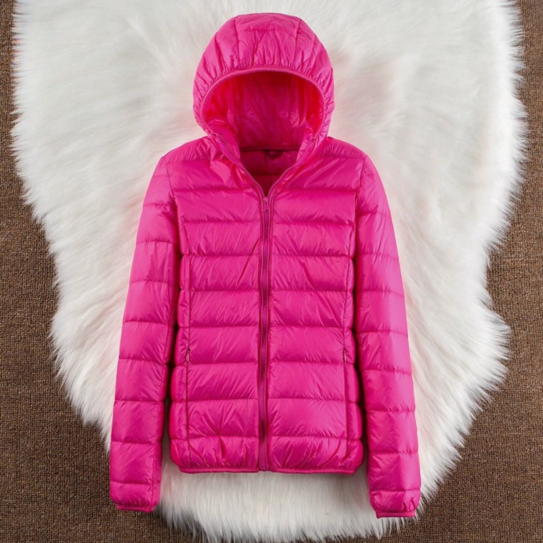 Metta padded jacket in hot pink laid flat, showing hood and zip front