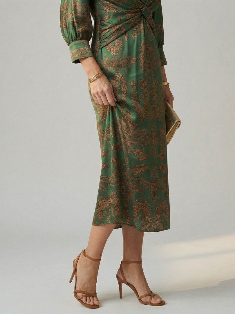Hazel twist-front printed midi dress in dark green, close-up of twist front and skirt