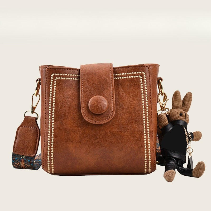 Ethel vintage shoulder bag in brown with gold studs, front view