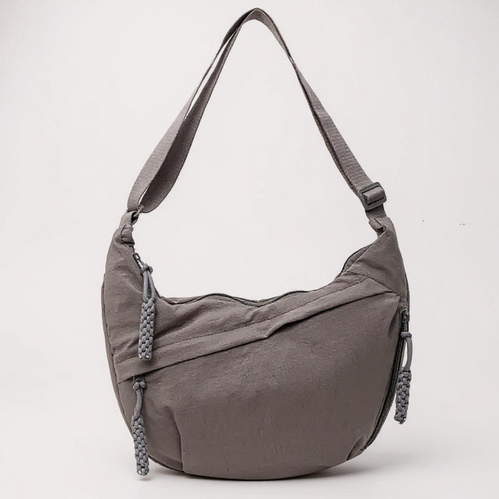 Beatrice crescent shoulder bag in grey, front view with adjustable strap