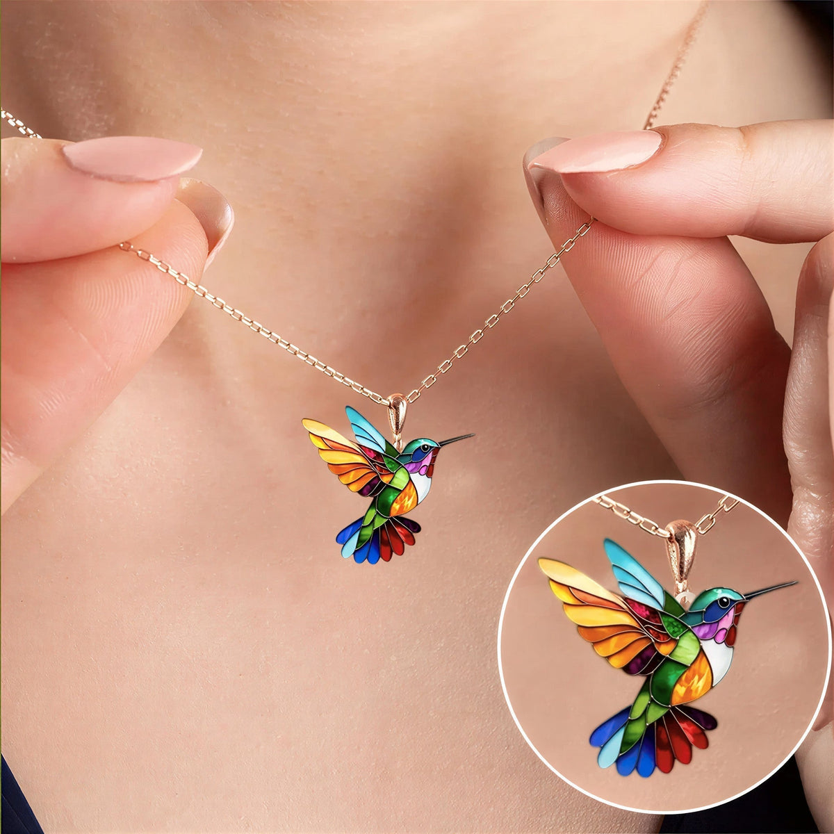 Lucky Hummingbird necklace worn on a rose gold chain, close-up of the pendant