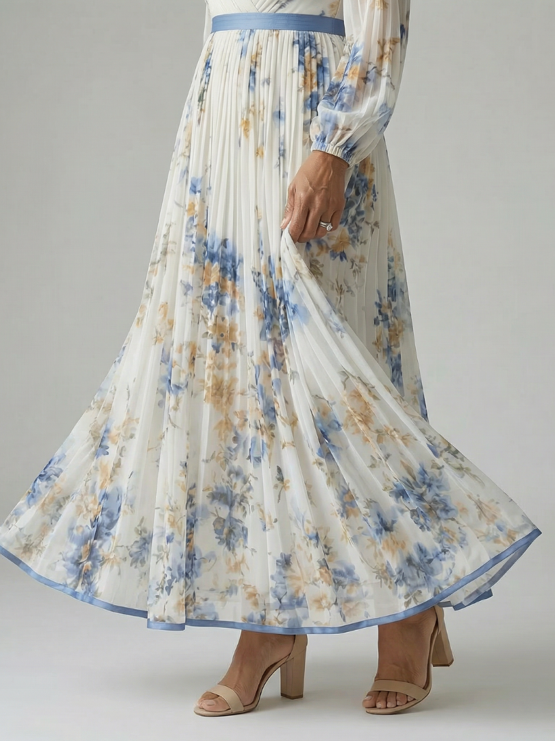 Rhiannon pleated floral wrap midi dress in white, close-up of pleated skirt and blue hem