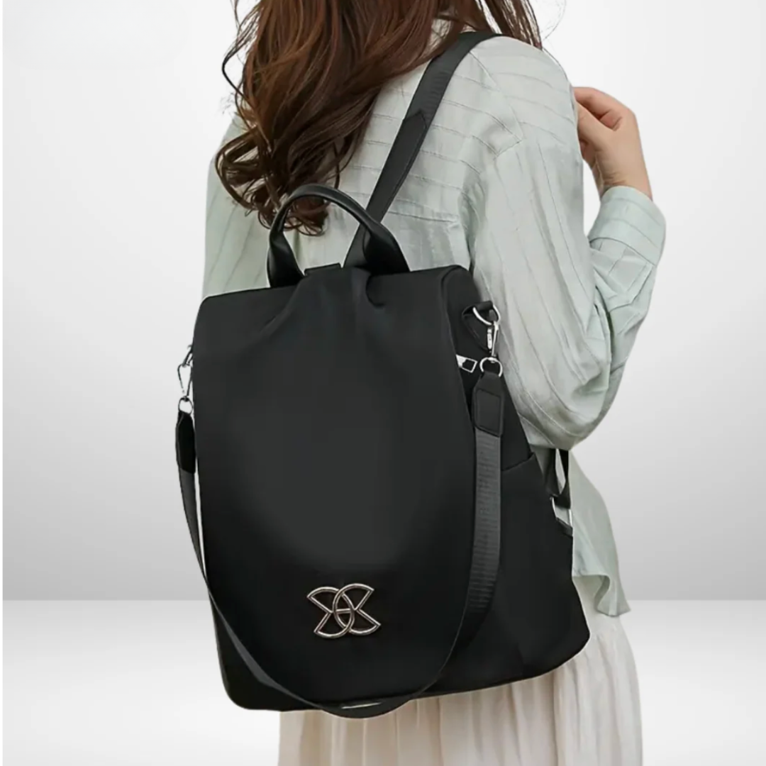 Rosalba anti-theft backpack in black, worn over one shoulder