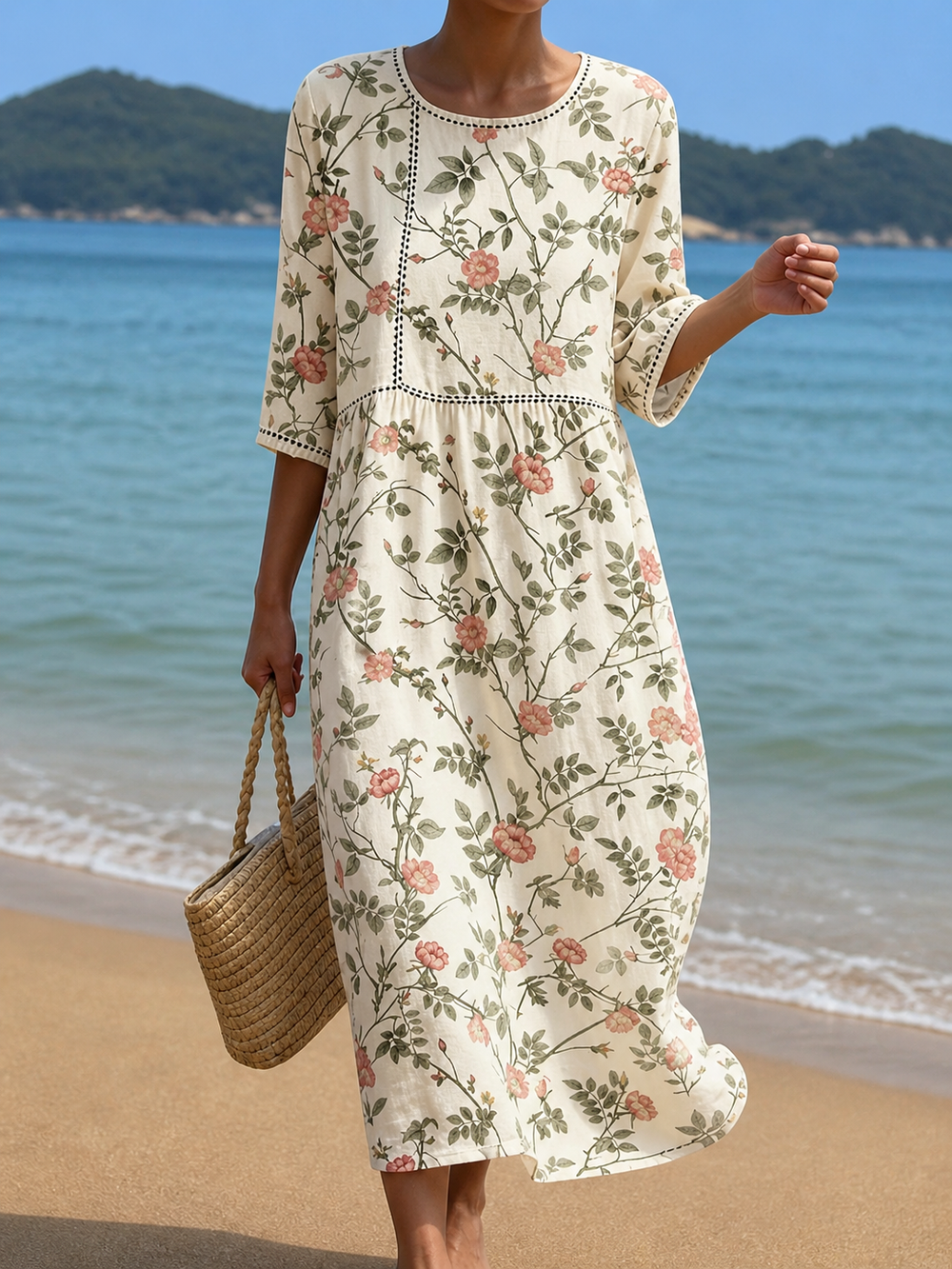 Casual floral print dress in cream with pink roses, full-length front view on the beach