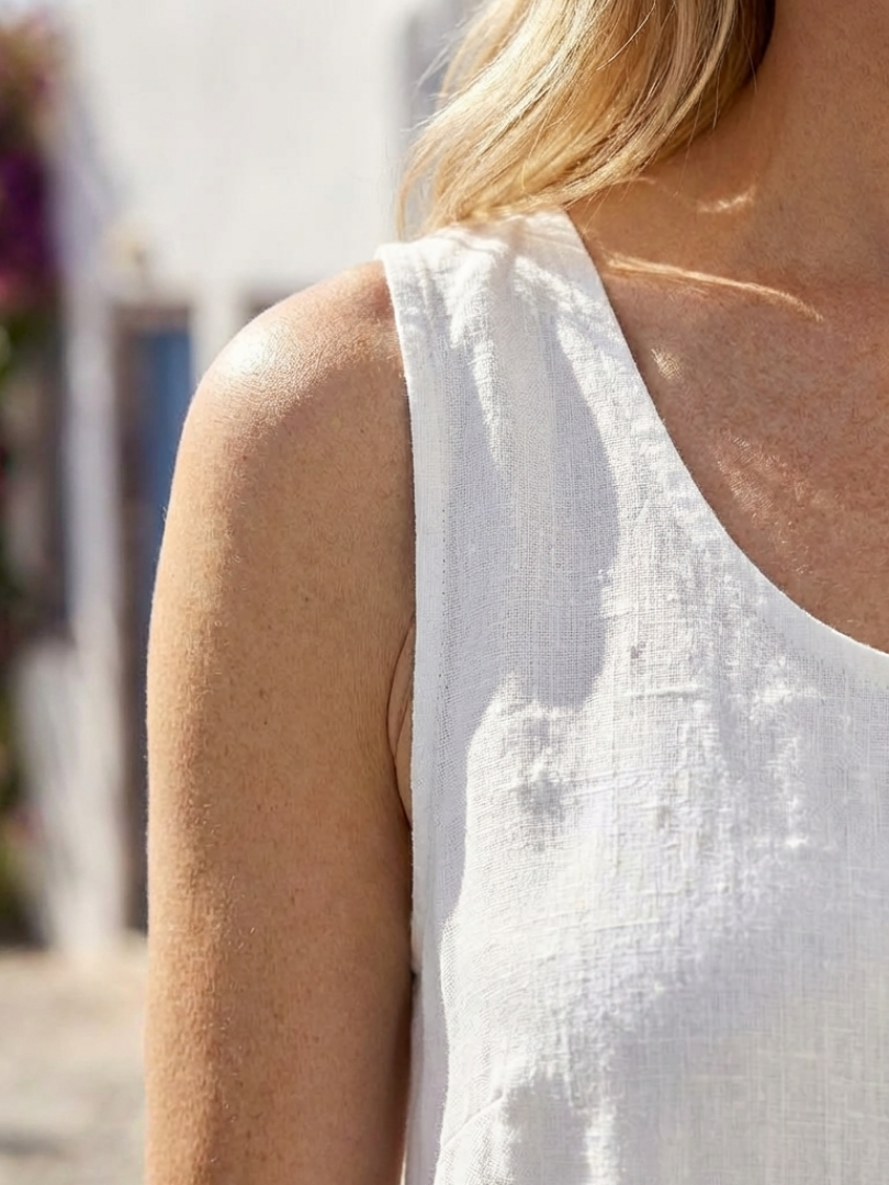 Ismera dress in white, close-up of shoulder and round neckline