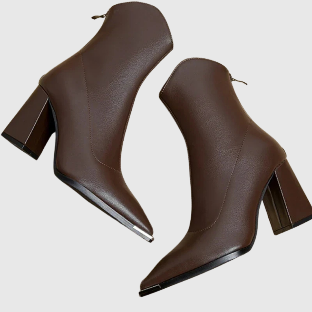 Brown pointed block heel ankle boots with metal toe tip, side view