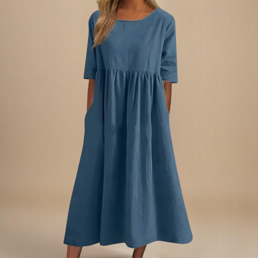 Sofia flattering midi dress in blue, front view with side pockets