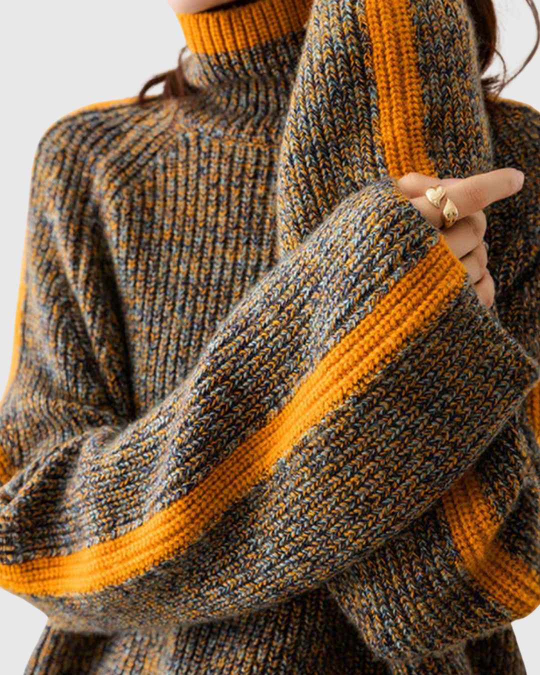 Thalira turtleneck sweater in grey-yellow marl, close-up of ribbed sleeve and cuff