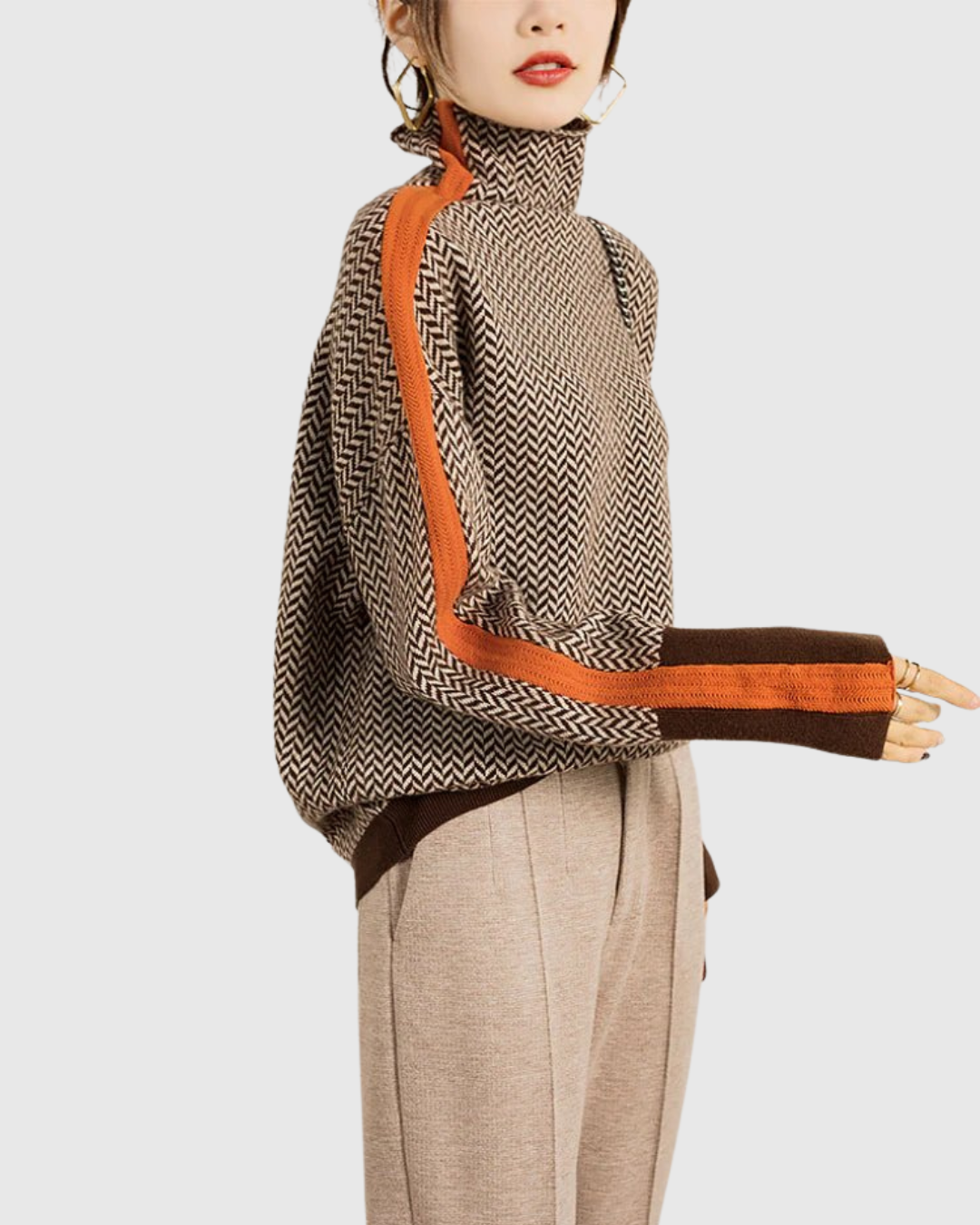 Celianne turtleneck sweater in orange and brown chevron, side view on model