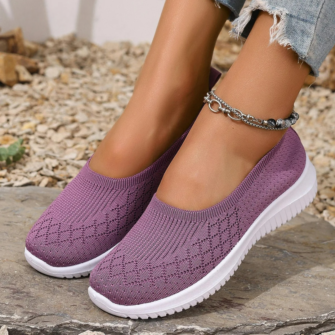 Estella slip-on shoes in purple, worn outdoors, front view