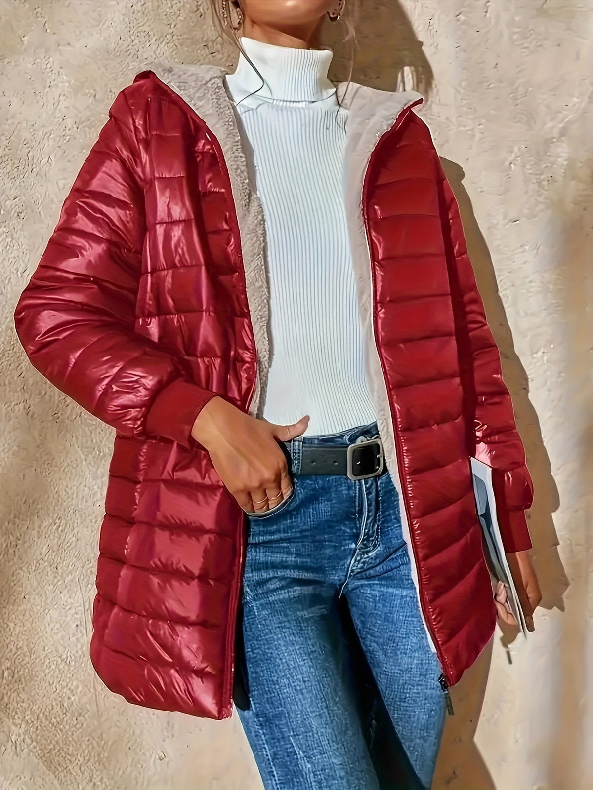 Lunera waterproof quilted jacket in burgundy, worn open with jeans