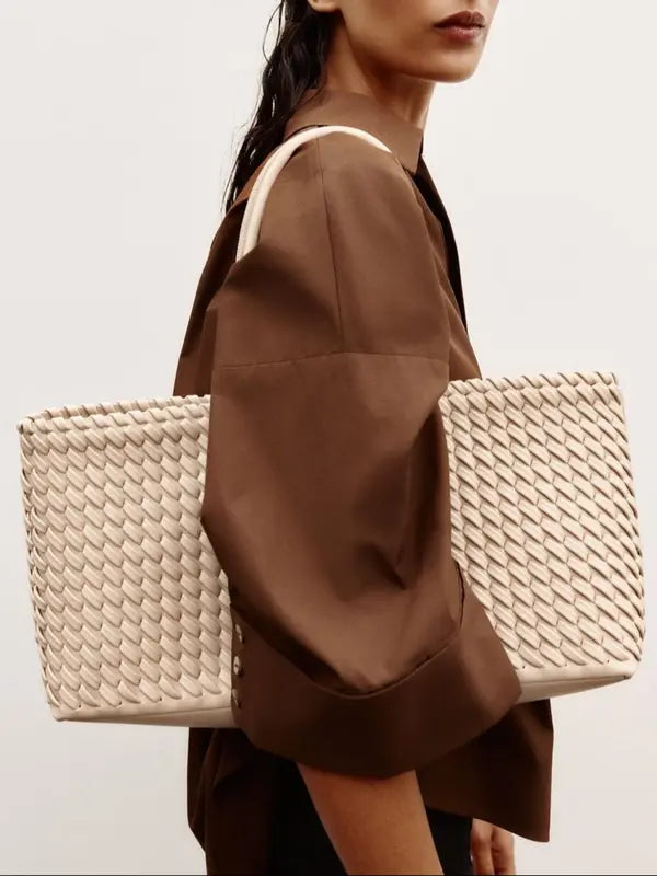 Lindsay woven tote bag in cream carried on the shoulder