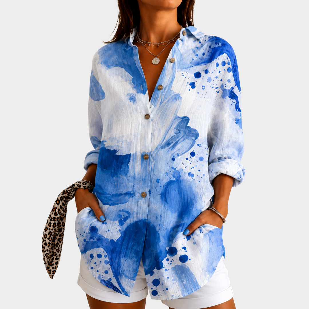 Coastal watercolour blouse in blue and white, front view worn with white shorts