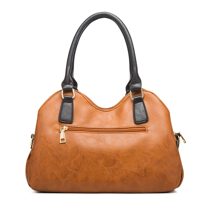 Zoe tote in tan brown, back view showing zip pocket and black-trimmed handles
