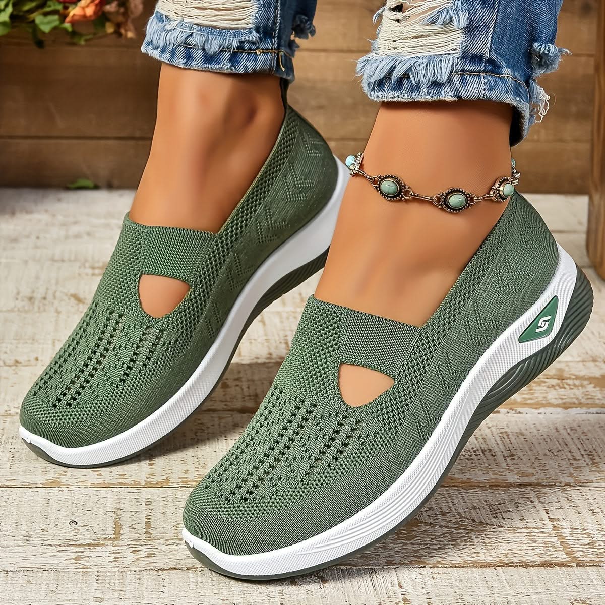 Elara slip-on sneakers in green, worn side view