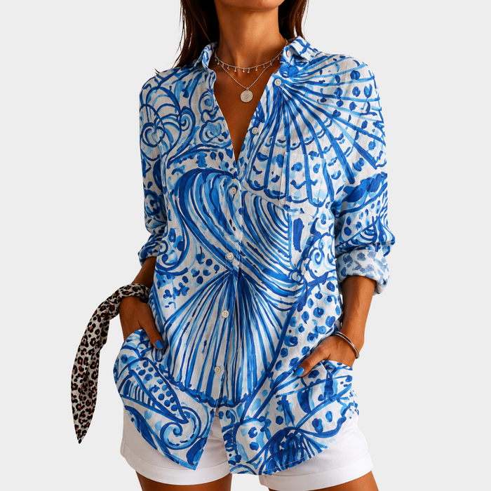 Seaside Shells shirt in blue and white shell print, front view worn with white shorts