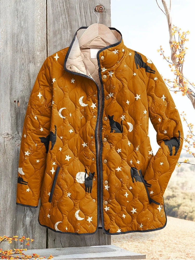 Hattie quilted jacket in mustard gold with black cat, star and moon print, front view
