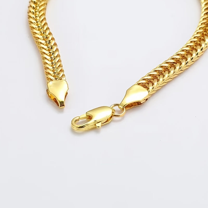Close-up of gold fox tail chain lobster clasp fastening