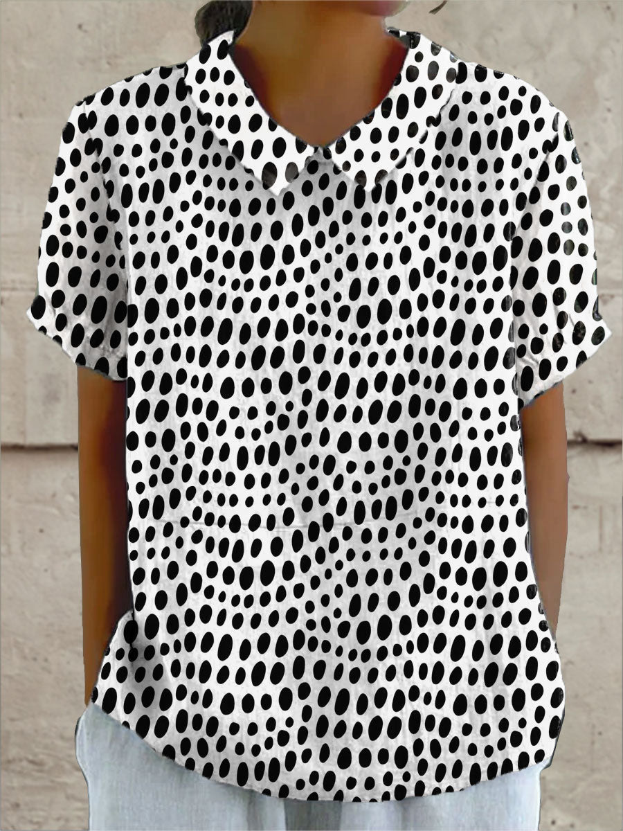 Lily polka dot print blouse in black and white, front view with collar and short sleeves