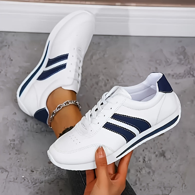 Saevy orthopedic shoes in white with navy stripes, close-up side view