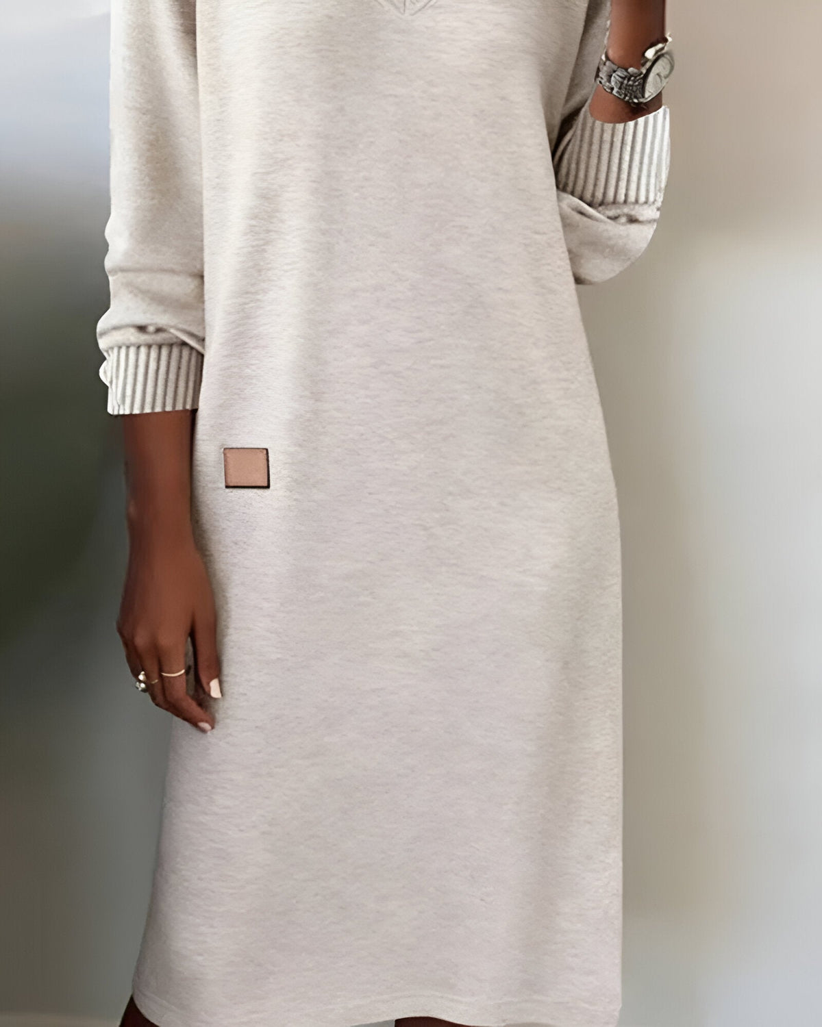 Joanna dress in white, detail of hip badge and skirt
