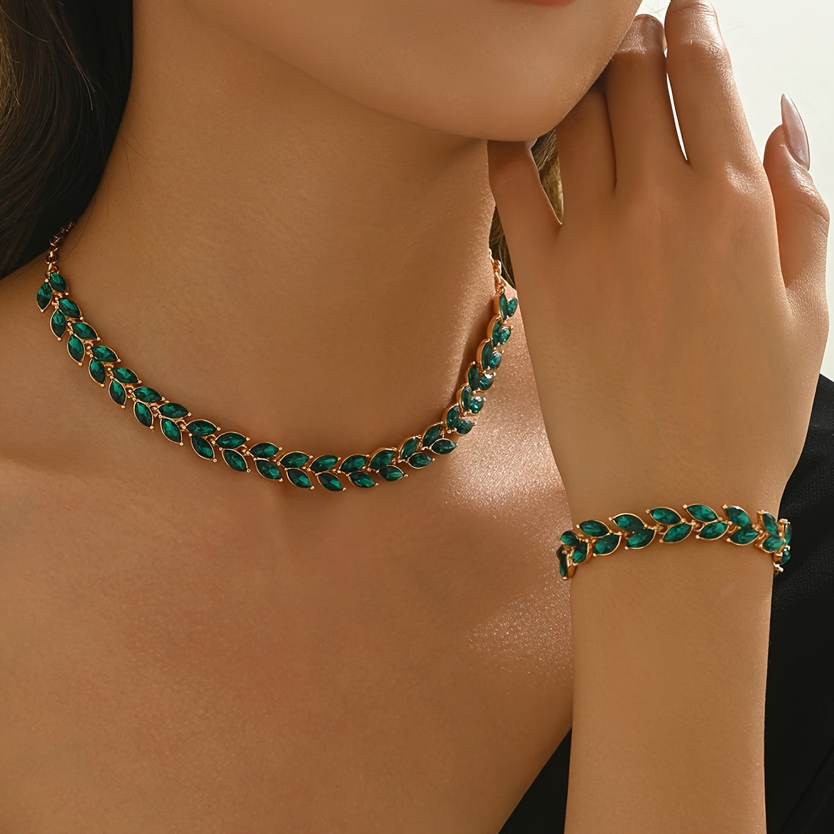 Green crystal choker necklace and matching bracelet on model, side view