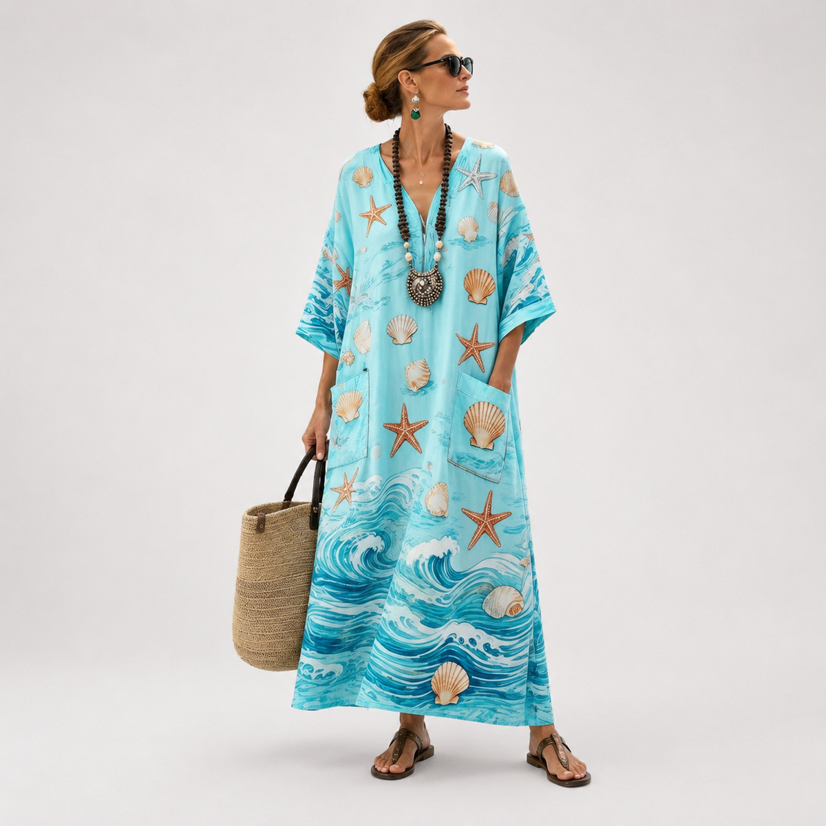 Long blue kaftan with starfish, shell and wave print, full-length front view