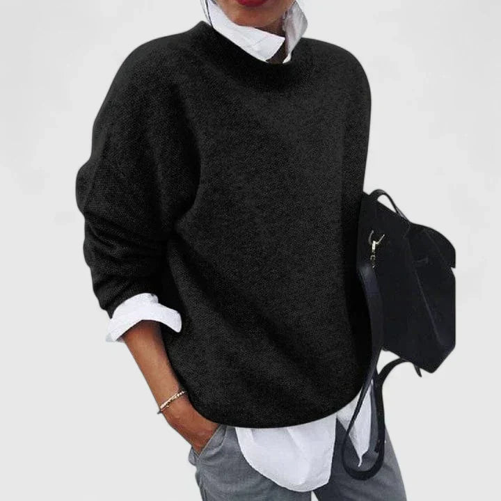 Lorna sophisticated sweater in black, worn over a white shirt, front view