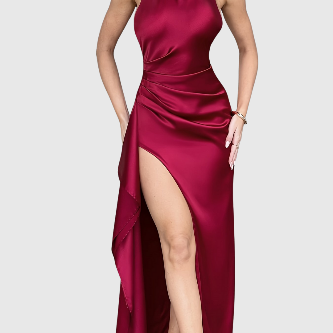 Tahlia satin evening dress in crimson red, close view of ruched waist and slit