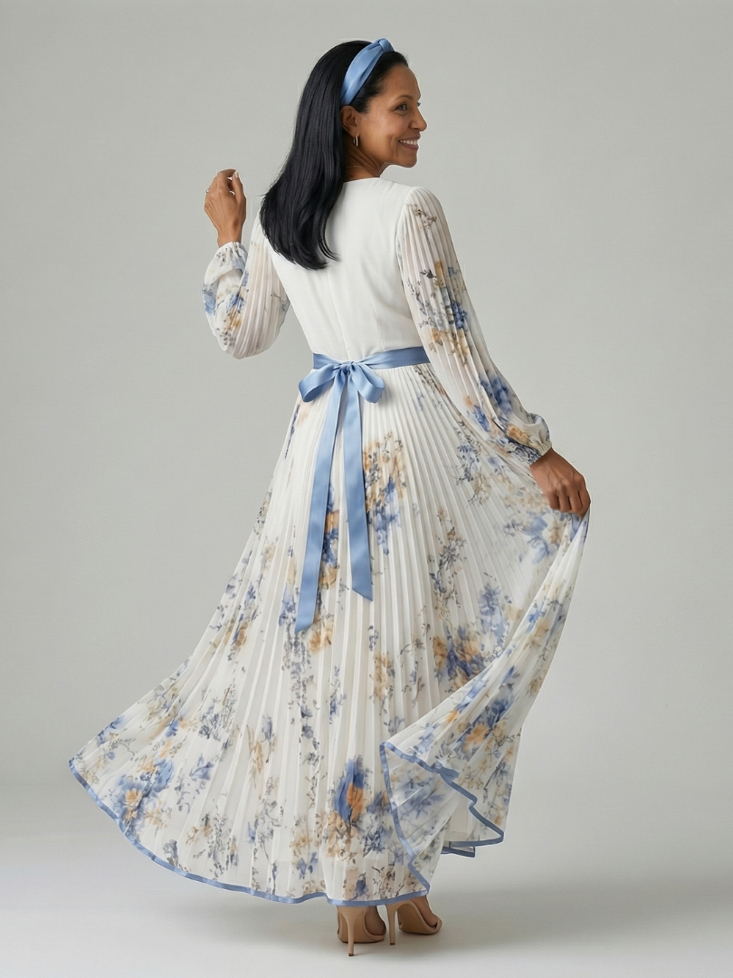 Rhiannon pleated floral wrap midi dress in white, back view with blue bow sash