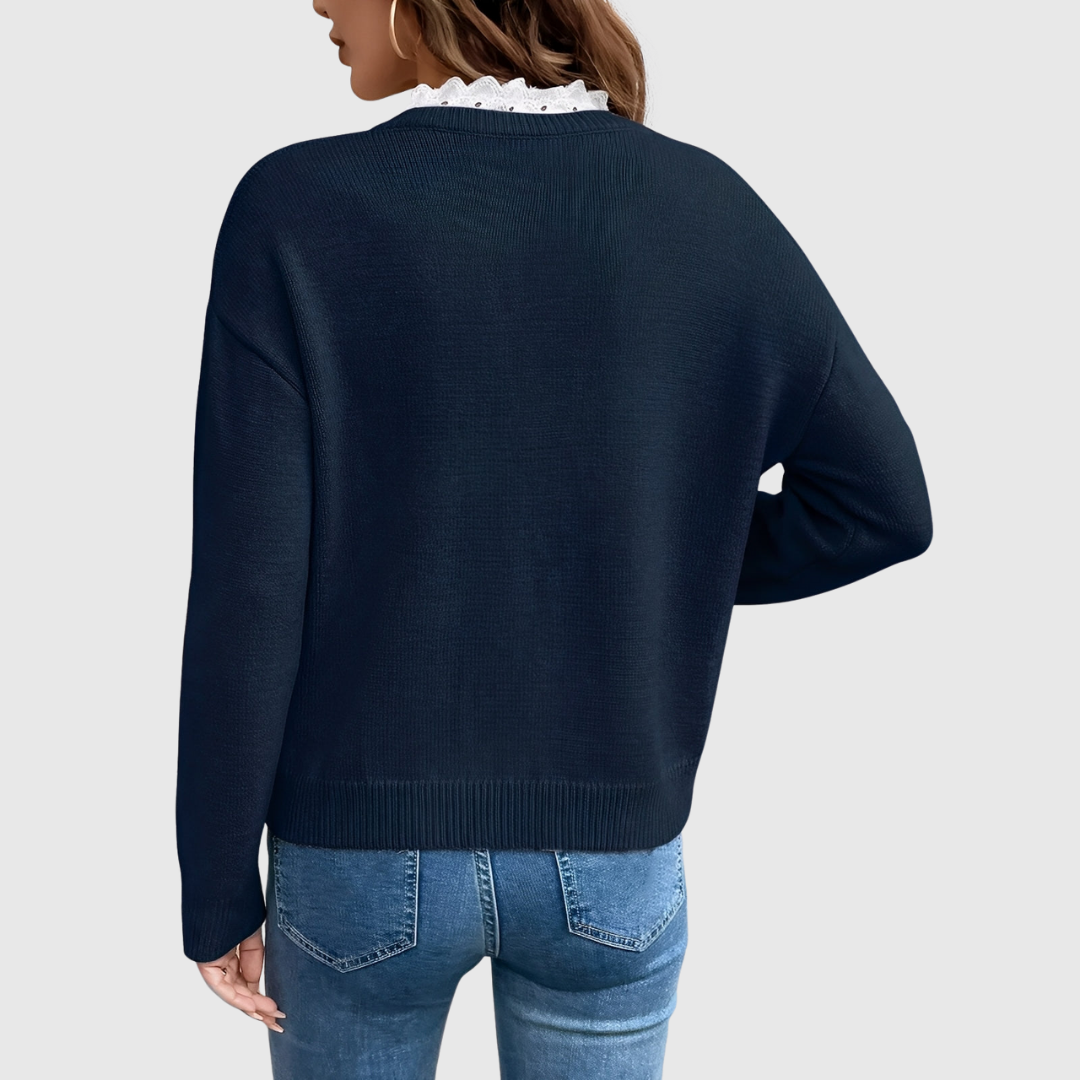 Faye elegant knit sweater in navy, back view showing ribbed hem