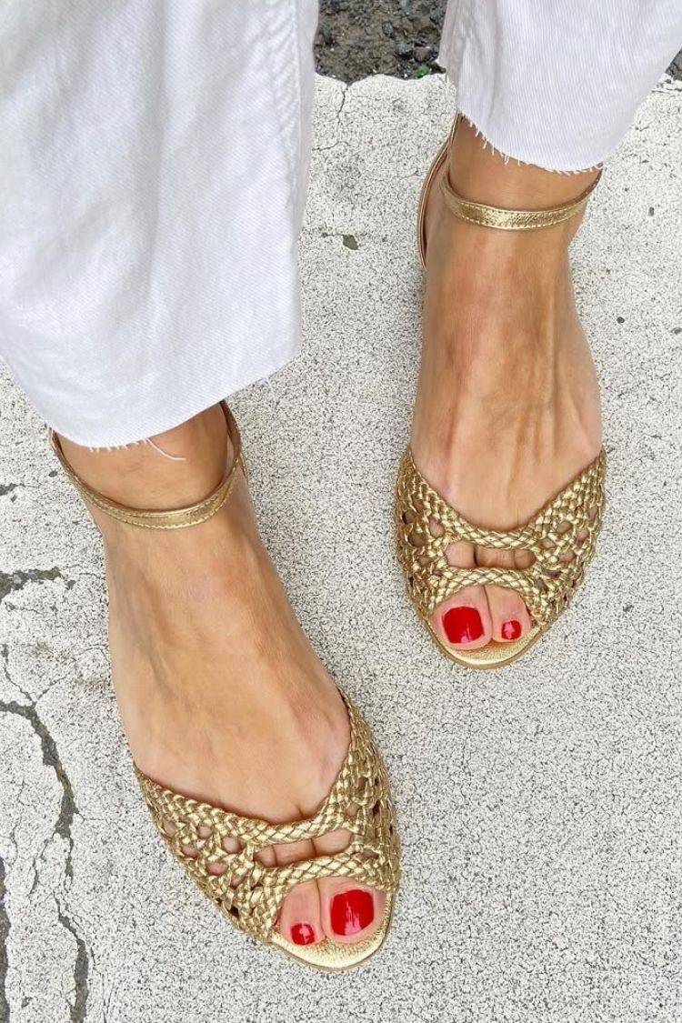 Isadora woven sandals in gold, front view on pavement