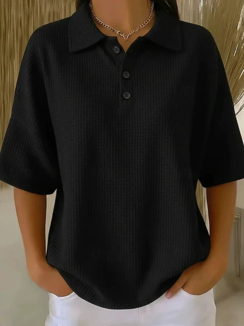 Peggie waffle polo blouse in black, front view on model