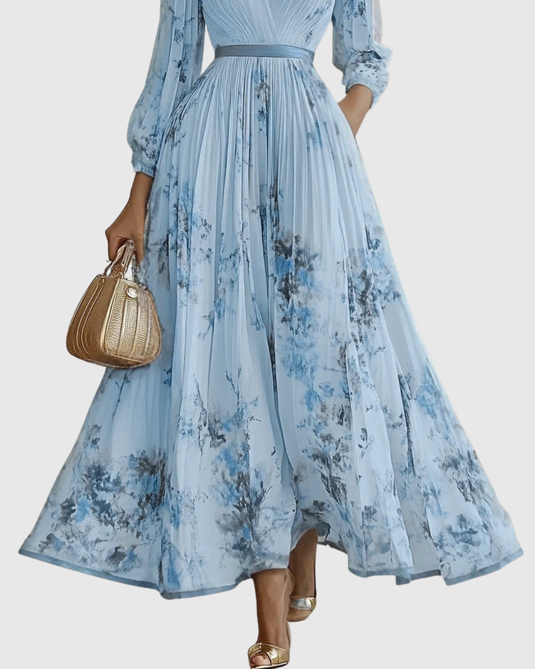 Rowella pleated maxi dress in blue, close-up of floral pleated skirt