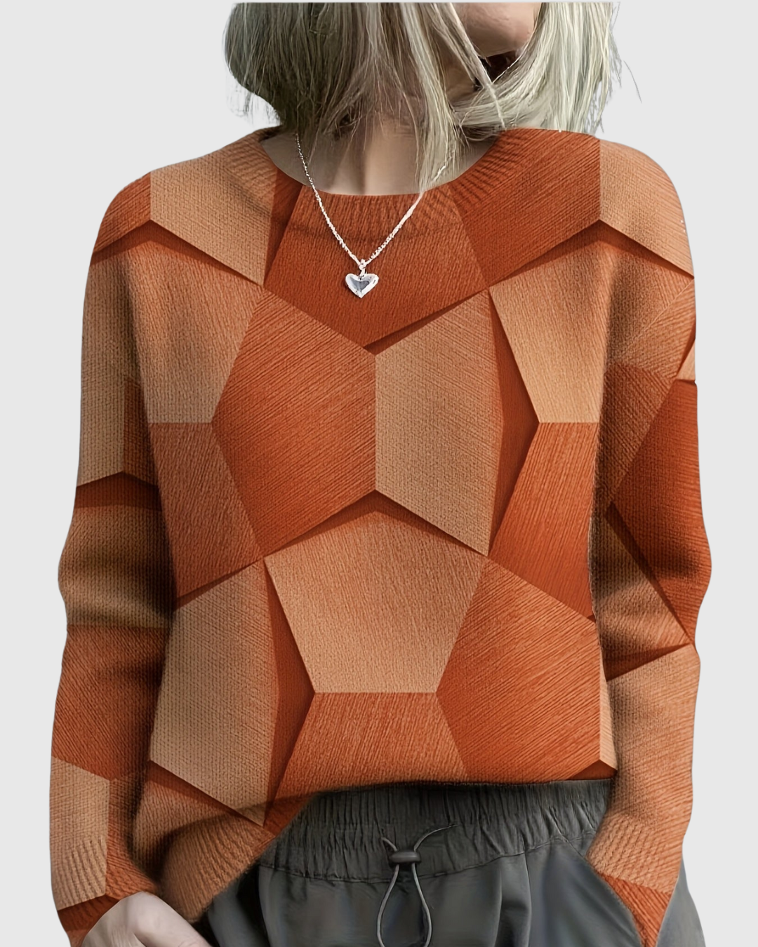 Lavinia geometric knit sweater in orange, front view on model