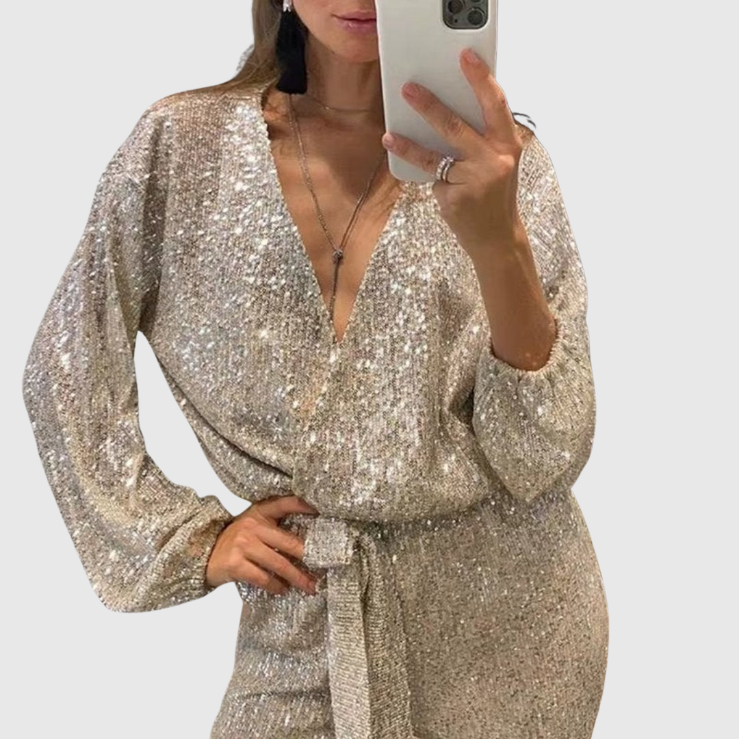 Aralyn sequinned jumpsuit in silver, close-up of deep V-neckline