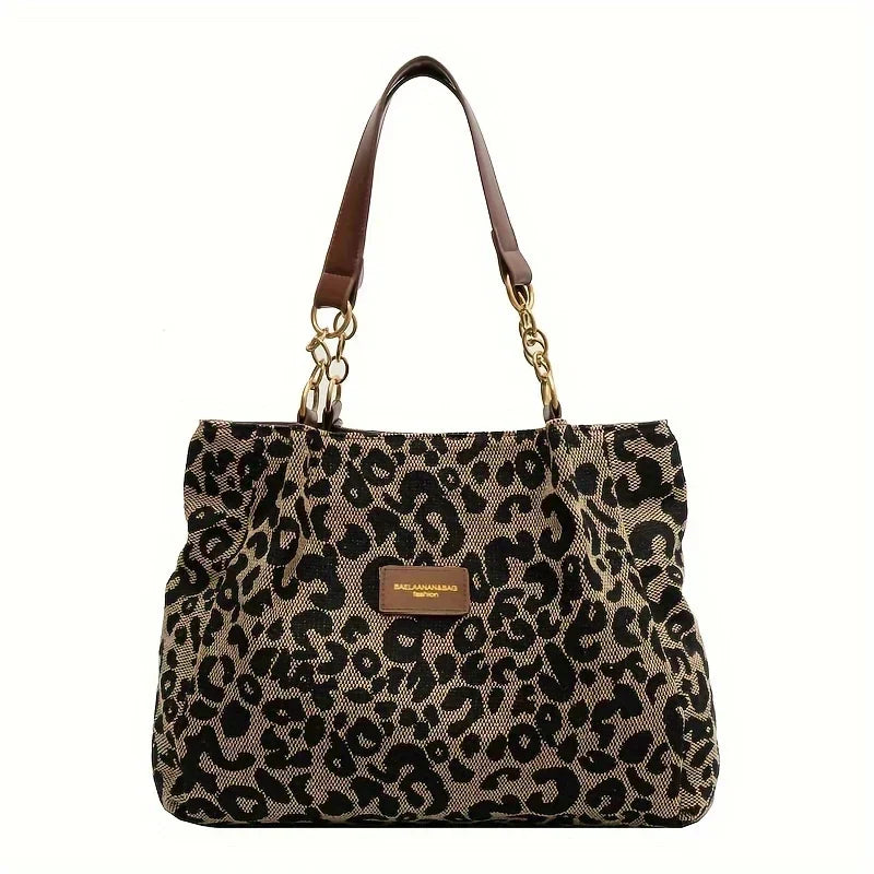 Tavira leopard charm tote bag, front view with brown handles