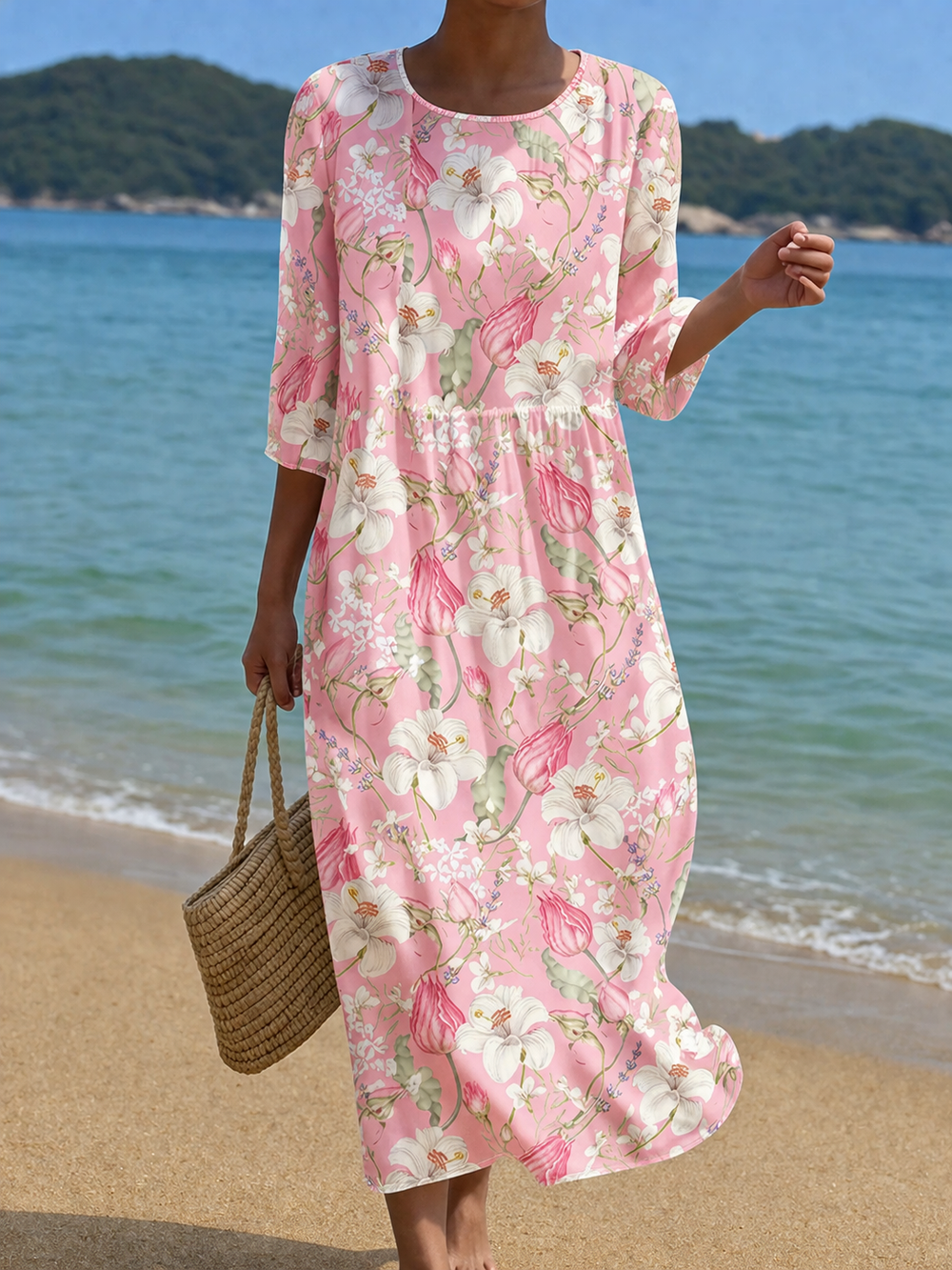 Casual floral print dress in pink with white lilies, full-length front view on the beach