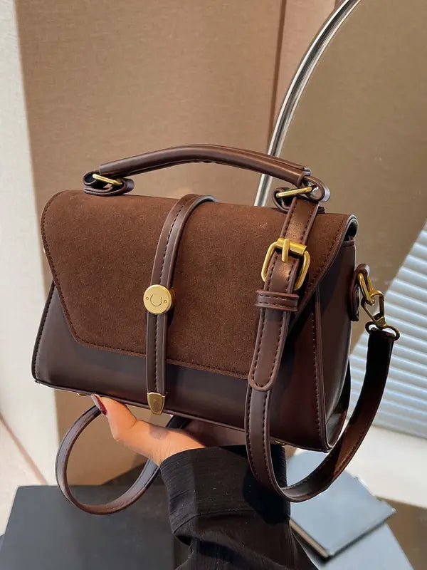 Alwina shoulder bag in chocolate brown, front view with buckled strap