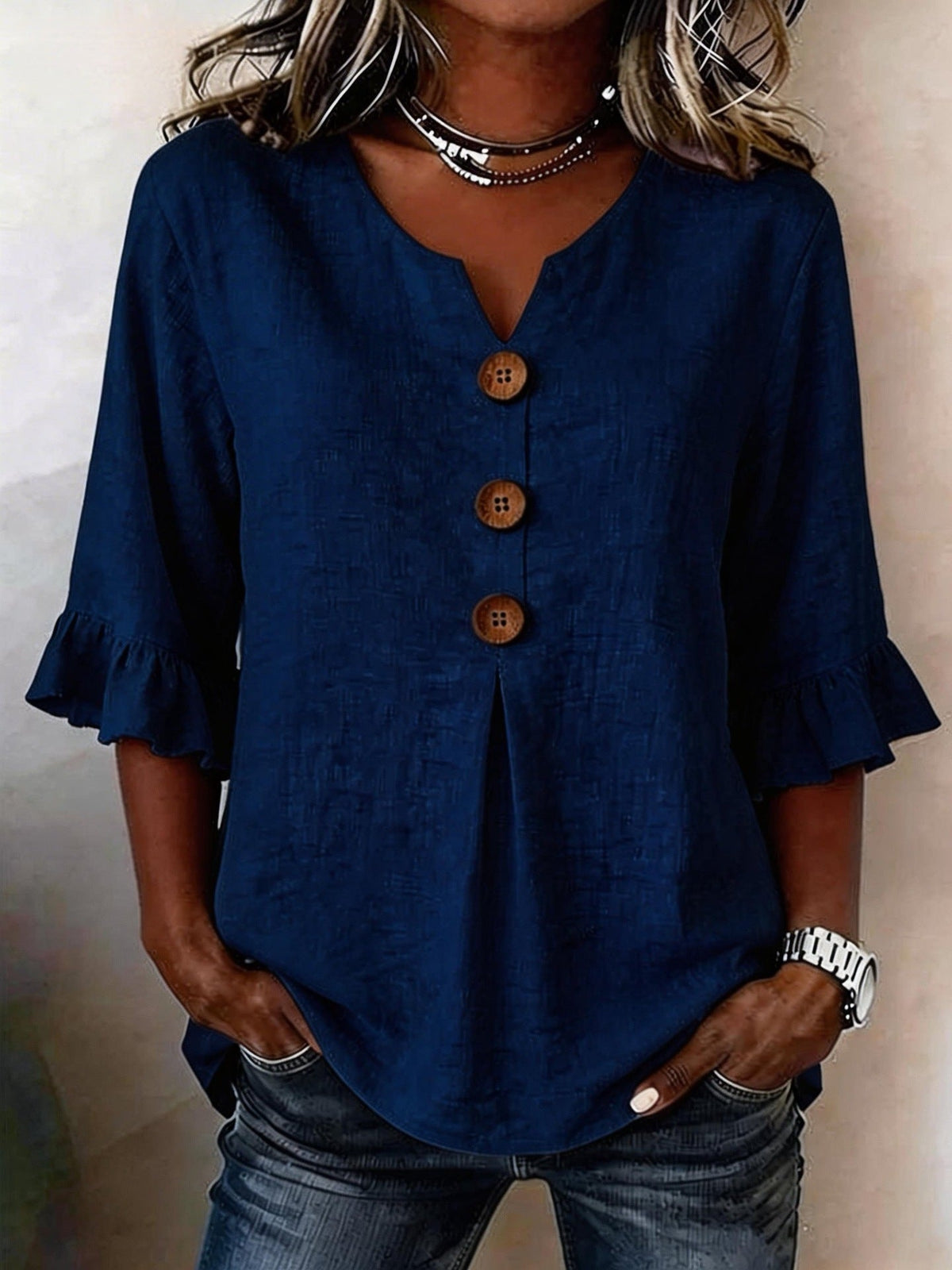 Jessara ruffle-sleeve blouse in dark blue, front view with split V-neck