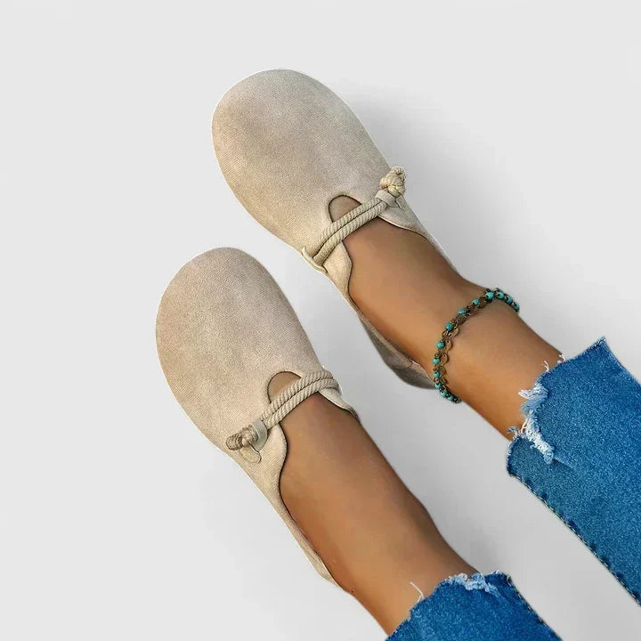 Margot loafers in beige, worn top view with cropped jeans