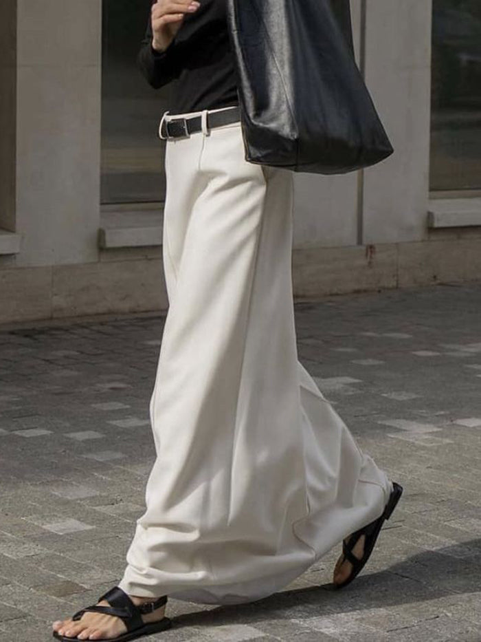 Katharine H-line midi skirt in white, side view while walking
