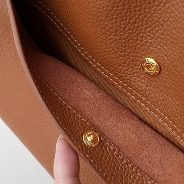 Magnetic press stud closure detail on the brown Valérie Dupré shoulder bag