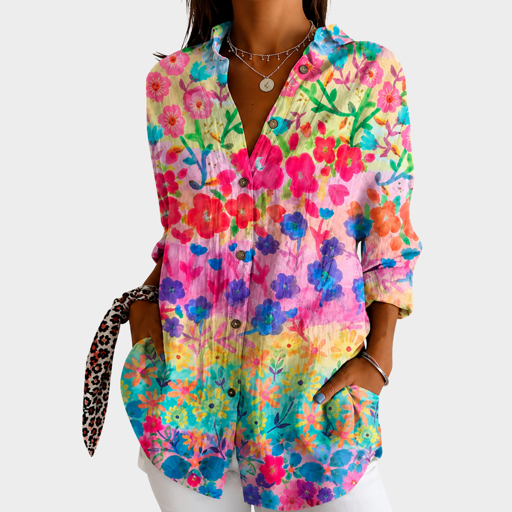 Pastel meadow floral blouse in multicoloured watercolour print, front view worn with white trousers