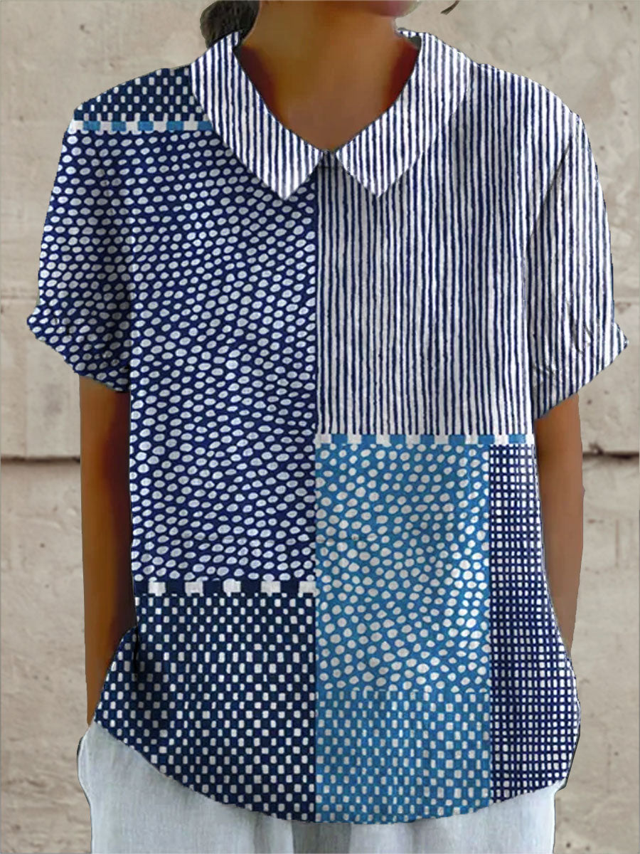 Allie patchwork print blouse in blue, front view with collar and short sleeves